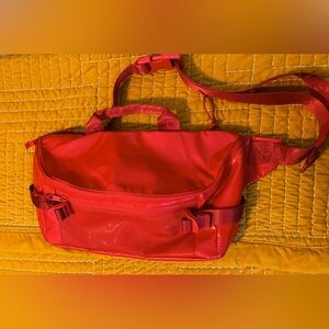 Calpak Terra Sling Crossbody Waist Bag Cherry Red Coated Ripstop.